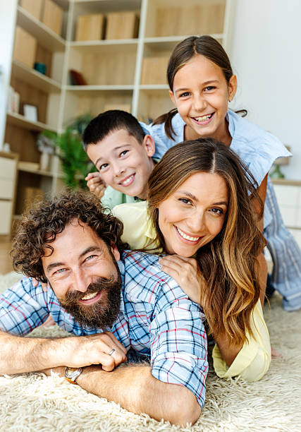 istock Family having fun in living room 2235522466