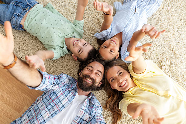 istock Family having fun on the floor 2235522495