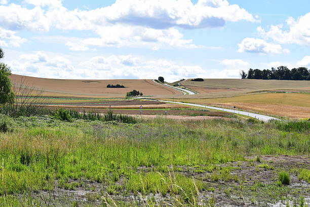 istock winding road through farmland 2235522841