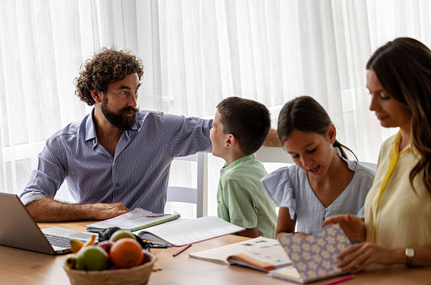 istock Afternoon family learning at home 2235523065