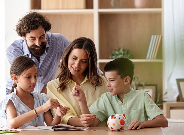 istock Family bonding during saving money lessons at home 2235523119