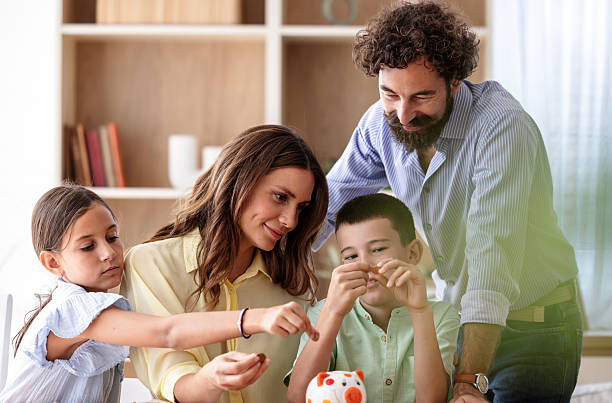 istock Family bonding during saving money lessons at home 2235523159