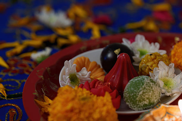 istock Diwali Decorations. Colorful sweets and flowers arranged on a festive table. 2235526559