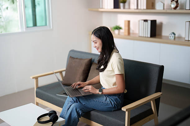 istock Remote Work. Young woman engaged in online tasks at home. 2235527516