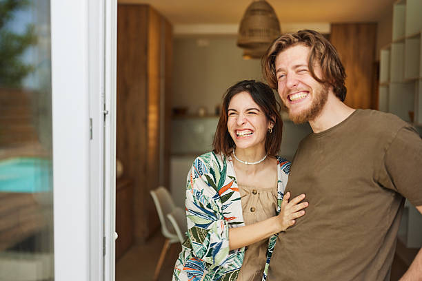istock Cheerful couple day dreaming embraced at home. 2235527876