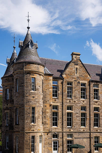 istock Historic Stone Building with Tower Against Clear Blue Sky in Edinburgh 2235528890