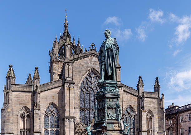 istock Stately Bronze Statue and Historic Cathedral in Edinburgh, Scotland 2235528922