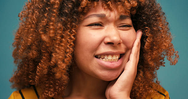 istock Young Hispanic woman feeling teeth pain on blue background 2235531118