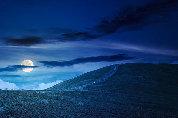 istock path for mountain tourism in summer at night 2235533559