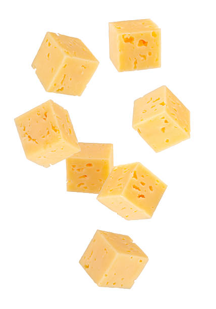 istock Cubes of regular cheese falling in space. Isolated on white. 2235536725