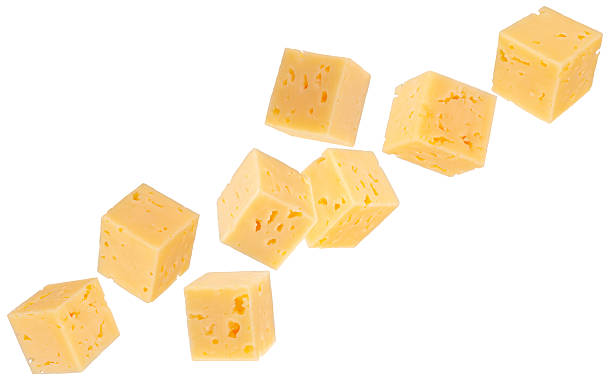 istock Cubes of regular cheese fly through space forming a chain shape Isolated on white 2235536731