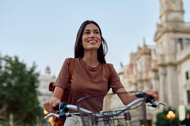 istock Young woman exploring Valencia by bicycle and enjoying summer vacations 2235537183