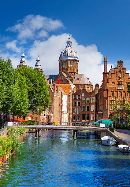 Historic Oudezijds Voorburgwal canal in De Wallen Amsterdam Netherlands
