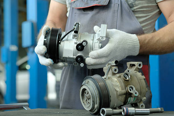 istock Car service.Replacement of the radiator compressor. 2235541590
