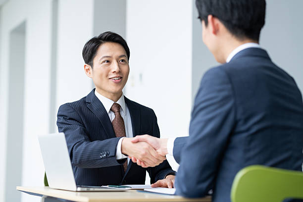 istock Middle-aged businessman discussing business in the office 2235541900