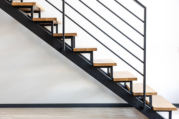 istock Loft style staircase. Black steel and wood. Geometric architecture. 2235543763