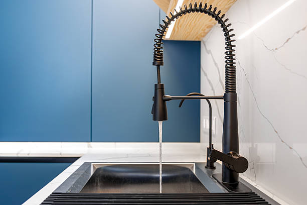 There is a tap in the stainless vegetable washing basin in the kitchen