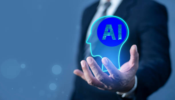 istock Hand holding a glowing holographic human head with an AI brain, symbolizing future intelligence. 2235545583