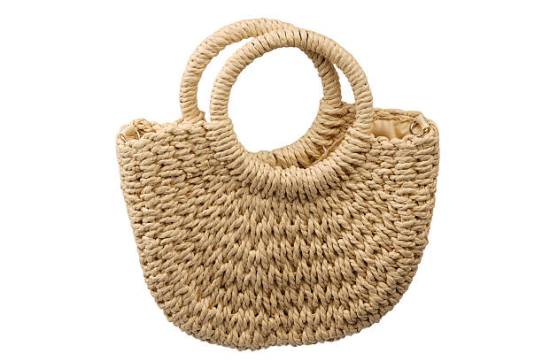 istock A beige straw bag isolated on a white background. 2235546840