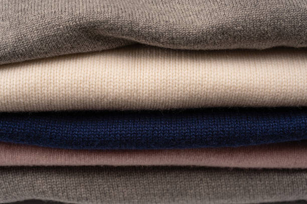 istock A group of warm sweaters isolated on a white background. 2235546860