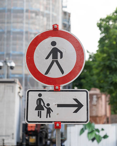 istock A pedestrian crossing sign featuring an arrow that points to the right 2235548478