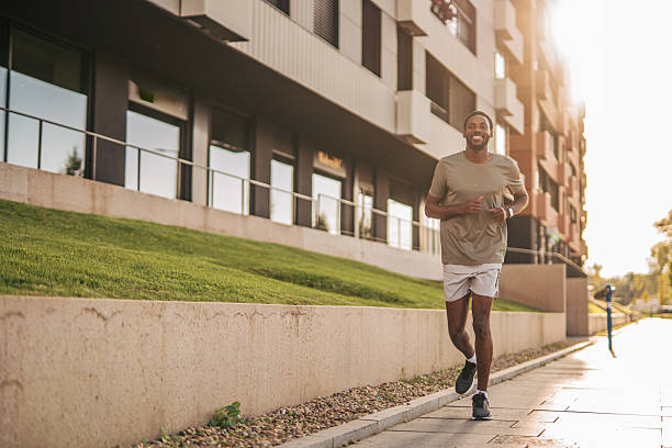 istock Young black man running in the city during sunset 2235548578