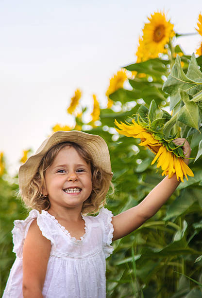 istock Child in a field of sunflowers. Selective focus. 2235551813