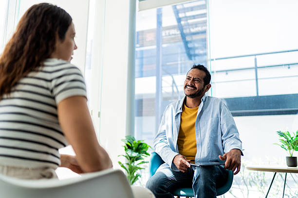 istock Mature man talking to patient during therapy session 2235552866