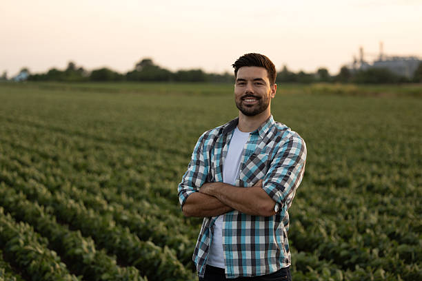 Confident man standing on farmland