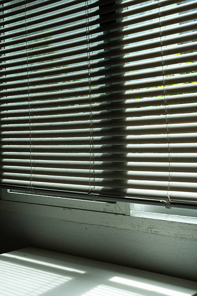 istock home interior window with vertical blinds shows a mix of dirty and clean surfaces, reflecting decoration design challenges creating  distinct mood and tone in the room 2235554518