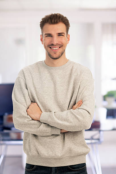 istock Confident young man portrait in a modern office 2235554704