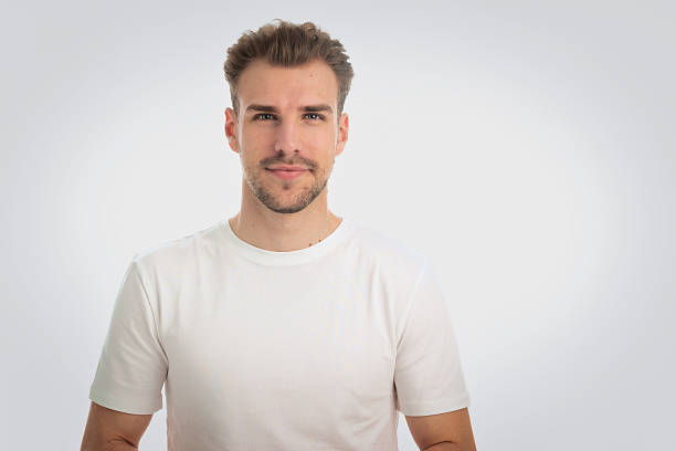 istock Portrait of young man on gray background 2235554842