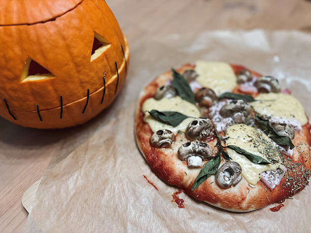 istock Halloween table. Homemade pizza with mushroom skulls 2235555887