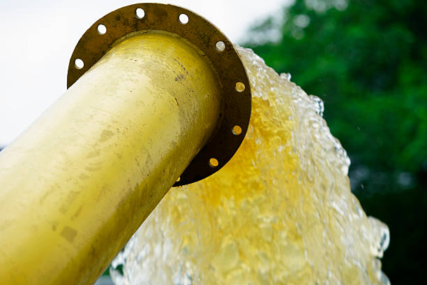 Water pump plumbing and pvc pipes exterior set-up in a home. DIY, repair, plumbing concepts.