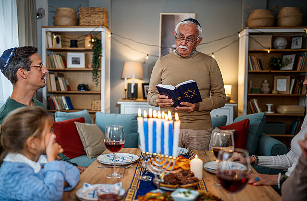istock Extended family celebrating Hanukkah with traditional dinner 2235562964