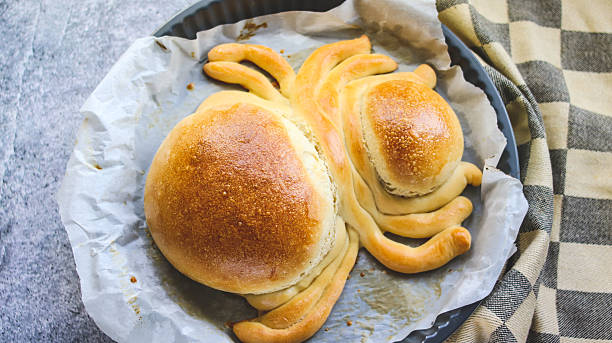 Halloween snack bread in the shape of a spider ready on the table