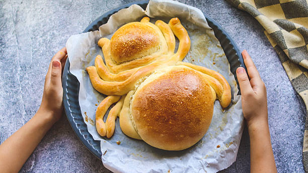 istock Halloween snack bread in the shape of a spider ready on the table 2235563303