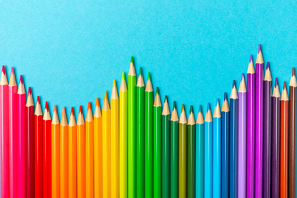 istock Colored pencils on a bright colored background. Equipment for coloring. Stationery for creativity.Back to school. Flatlay. Children's Creativity and Education. Rainbow.Space for text. Copy space. 2235565221