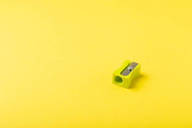 istock Pencil sharpener on bright colored background. Pencil and pencil shavings. Stationery. School supplies. School products. Flat lay. Place for text. copy space. 2235565483