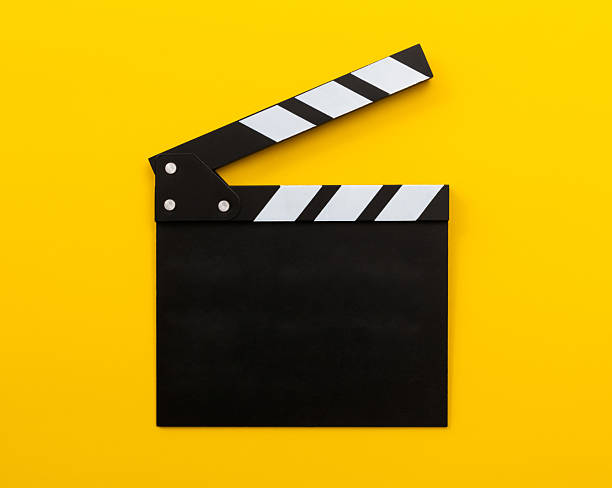 istock Single film slate on yellow background 2235568224