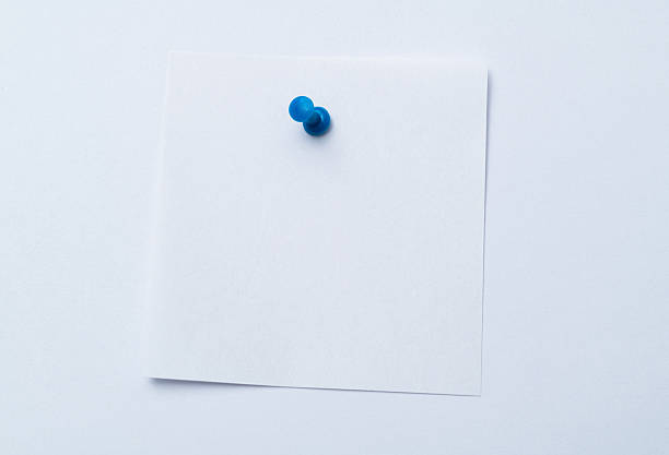 istock White note paper with blue pin isolated on white background 2235568271
