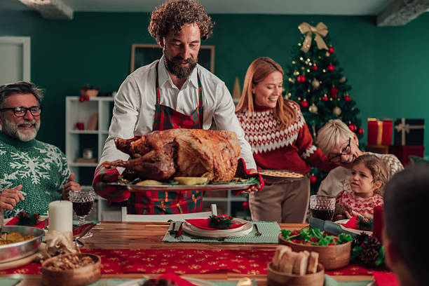istock Family enjoying christmas dinner with roasted turkey 2235568976