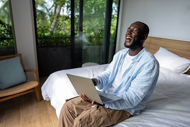 istock A happy freelance man reading good feedback from his client on his project on a laptop 2235573763
