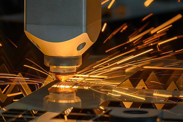 istock Close up scene the fiber laser cutting machine cut the metal plate control by CNC program. 2235574301