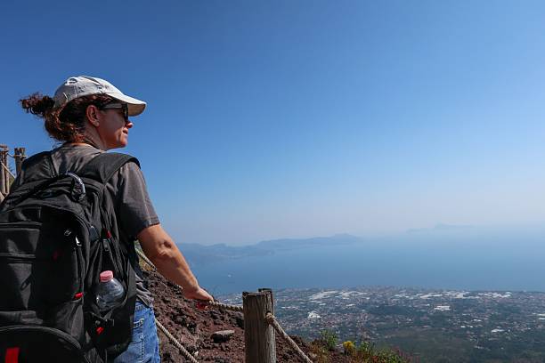 istock Woman enjoying view from Mount Vesuvius 2235574653