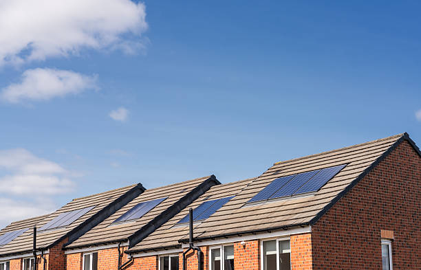 istock Modern houses with solar panels 2235575479