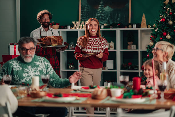 istock Family celebrating christmas dinner at home 2235575867