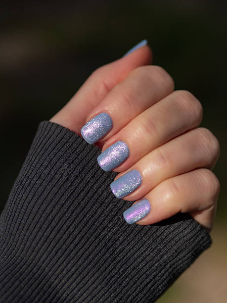 istock Hand with Nail Polish. Nail Lacquer Swatch Closeup 2235578947