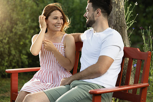 istock Couple enjoying sunny afternoon in garden setting 2235579295