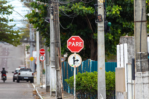 istock Traffic sign indicating stop, go straight ahead and turn right. 2235580252